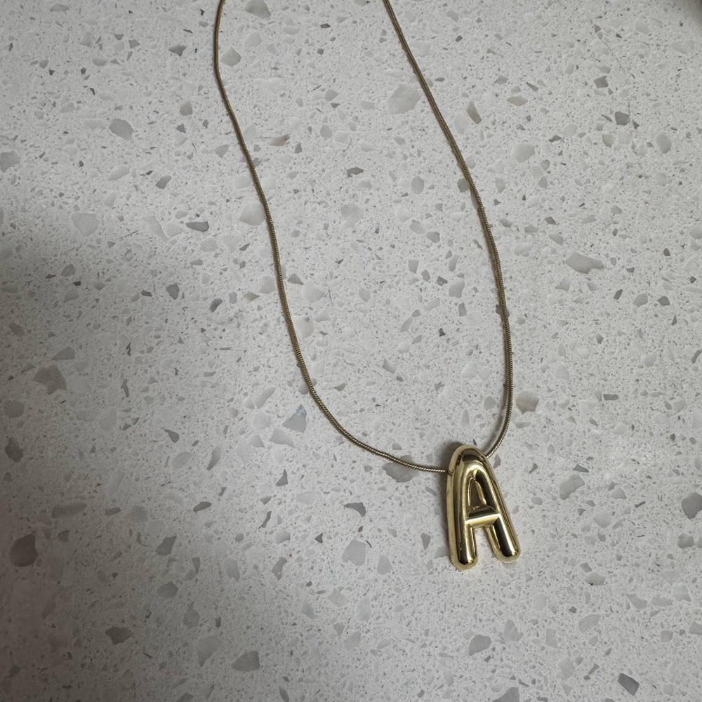 Gold Necklace with Padlock and Letter A Charm from Bauble Bar